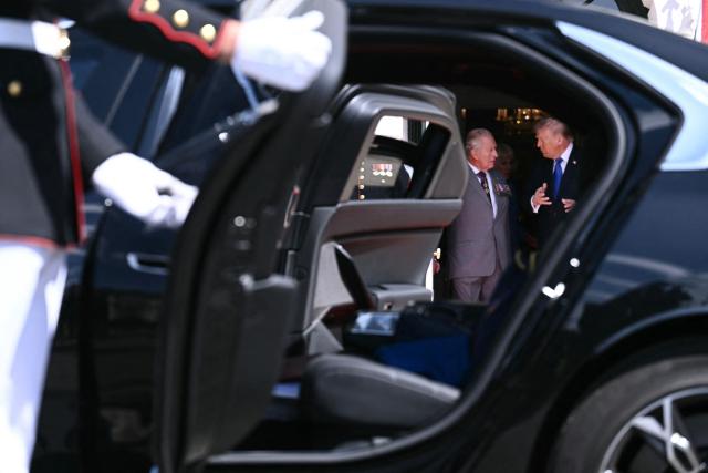 US President Donald Trump speaks with Britain's King Charles III during a farewell ceremony on the South Lawn of the White House in Washington, DC, on April 30, 2026. King Charles III and Queen Camilla are wrapping up their visit to the United States and will head to Bermuda next. (Photo by Brendan SMIALOWSKI / AFP)