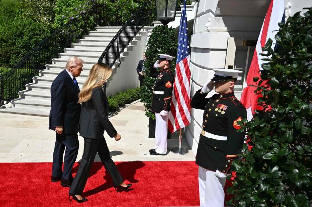 US President Donald Trump and First Lady Melania Trump walks back into the White House after a formal farewell with Britain's King Charles III and Queen Camilla in Washington, DC, on April 30, 2026. King Charles III and Queen Camilla are wrapping up their visit to the United States and will head to Bermuda next. (Photo by Mandel NGAN / AFP)