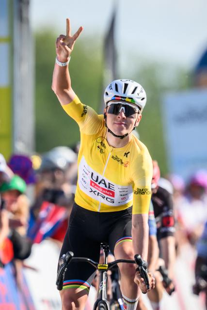UAE Team Emirates-XRG's Slovenian rider Tadej Pogacar celebrates as he crosses the finish line winning the second stage of the Tour of Romandie UCI cycling World tour, 173.1 km from Rue to Vucherens, in Vucherens, on April 30, 2026. (Photo by Fabrice COFFRINI / AFP)