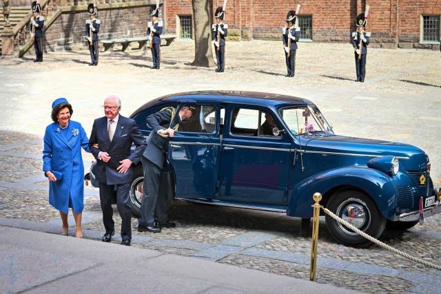 King Carl XVI Gustaf of Sweden ans Queen Silvia of Sweden arrive in a 1946 Volvo PV60 to attend a lunch at the City Hall as part of the celebrations of the king's 80th birthday in Stockholm, Sweden, on April 30, 2026. (Photo by Claudio BRESCIANI / TT News Agency / AFP) / Sweden OUT