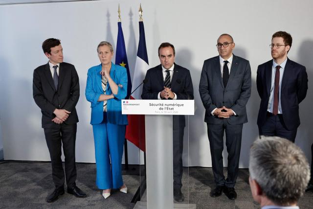 France's Prime Minister Sebastien Lecornu (C) speaks flanked by France’s junior Minister in charge of artificial intelligence Anne Le Henanff (2nd L), France's Interior Minister Laurent Nunez (2nd R) France's Education Minister Edouard Geffray (L) and France’s junior Minister for Public Accounts David Amiel (R) during a visit to the headquarters of the French National Agency for Secure Documents (Agence nationale des titres securises - ANTS), in Paris, on April 30, 2026. The National Agency for Secure Documents suffered a massive data breach on 15 April, 2026. The data of nearly 12 million individuals and businesses had been affected by the attack. (Photo by STEPHANE DE SAKUTIN / AFP)