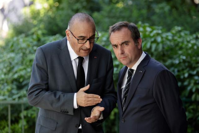 France's Prime Minister Sebastien Lecornu (R) and France's Interior Minister Laurent Nunez speak after a visit to the headquarters of the French National Agency for Secure Documents (Agence nationale des titres securises - ANTS), in Paris, on April 30, 2026. The National Agency for Secure Documents suffered a massive data breach on 15 April, 2026. The data of nearly 12 million individuals and businesses had been affected by the attack. (Photo by STEPHANE DE SAKUTIN / AFP)