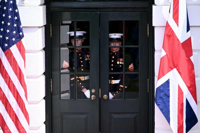 Guards look on during a farewell ceremony for Britain's King and Queen on the South Lawn of the White House in Washington, DC, on April 30, 2026. King Charles III and Queen Camilla are wrapping up their visit to the United States and will head to Bermuda next. (Photo by Brendan SMIALOWSKI / AFP)