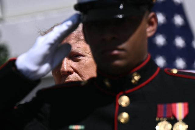 US President Donald Trump arrives to greet Britain's King Charles III and Queen Camilla during a farewell ceremony on the South Lawn of the White House in Washington, DC, on April 30, 2026. King Charles III and Queen Camilla are wrapping up their visit to the United States and will head to Bermuda next. (Photo by Brendan SMIALOWSKI / AFP)