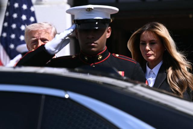 US President Donald Trump and First Lady Melania Trump arrive to greet Britain's King Charles III and Queen Camilla during a farewell ceremony on the South Lawn of the White House in Washington, DC, on April 30, 2026. King Charles III and Queen Camilla are wrapping up their visit to the United States and will head to Bermuda next. (Photo by Brendan SMIALOWSKI / AFP)