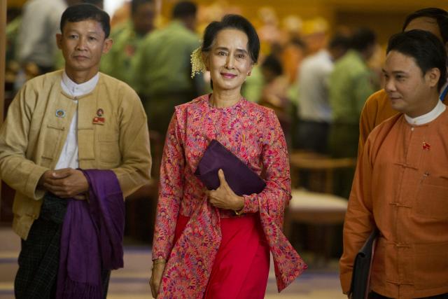 (FILES) Myanmar's National League for Democracy (NLD) chairperson Aung San Suu Kyi leaves after the new lower house parliamentary session in Naypyidaw on February 1, 2016. Myanmar's junta-chief turned president on April 30, 2026 ordered deposed leader Aung San Suu Kyi to be moved to house arrest, five years after sweeping her into detention in a 2021 coup. (Photo by Ye Aung Thu / AFP)