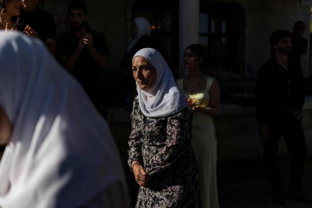 People take part in a traditional wedding ceremony of the Circassian community in the northern Israeli town of Rehaniya, by the Israel border with Lebanon on April 30, 2026. (Photo by Ilia YEFIMOVICH / AFP)