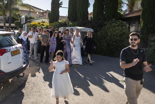 People take part in a traditional wedding ceremony of the Circassian community in the northern Israeli town of Rehaniya, by the Israel border with Lebanon on April 30, 2026. (Photo by Ilia YEFIMOVICH / AFP)