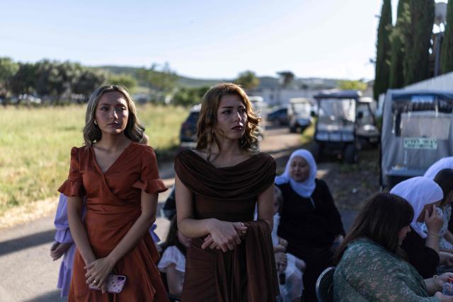 People take part in a traditional wedding ceremony of the Circassian community in the northern Israeli town of Rehaniya, by the Israel border with Lebanon on April 30, 2026. (Photo by Ilia YEFIMOVICH / AFP)