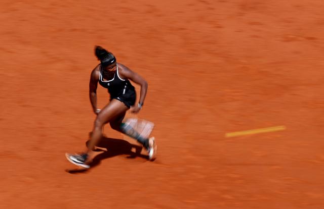USA's Hailey Baptiste returns a ball to Russia's Mirra Andreeva during their 2026 WTA Tour Madrid Open tennis tournament women's semi-final singles match at the Caja Magica in Madrid, on April 30, 2026. (Photo by Thomas COEX / AFP)