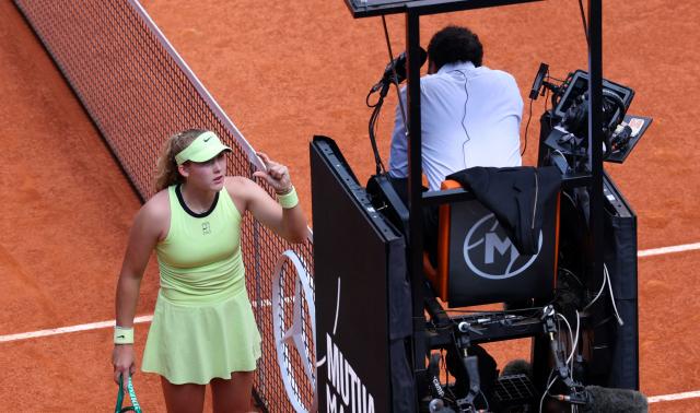 Russia's Mirra Andreeva argues a line call with the referee during her 2026 WTA Tour Madrid Open tennis tournament women's semi-final singles match against USA's Hailey Baptiste at the Caja Magica in Madrid, on April 30, 2026. (Photo by Thomas COEX / AFP)