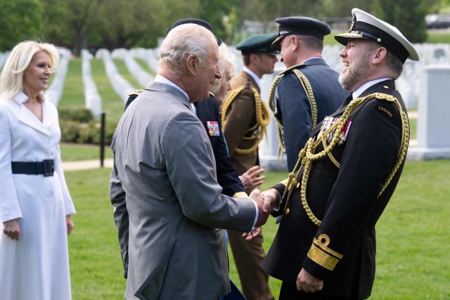 Britain's King Charles III and Queen Camilla attend a ceremony at Arlington National Cemetary in Arlington, Virginia on April 30, 2026. (Photo by SAUL LOEB / POOL / AFP)