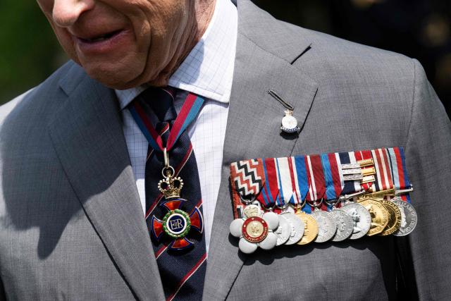 A detail of Britain's King Charles III's medals during a ceremony at Arlington National Cemetary in Arlington, Virginia on April 30, 2026. (Photo by SAUL LOEB / POOL / AFP)