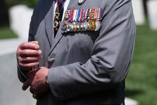 A detail of Britain's King Charles III's medals during a ceremony at Arlington National Cemetary in Arlington, Virginia on April 30, 2026. (Photo by SAUL LOEB / POOL / AFP)