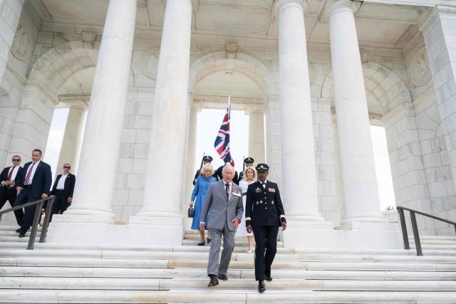Britain's King Charles III and Queen Camilla, escorted  by US Army Maj. Gen. Antoinette Gant (R) and White House Chief of Protocol Monica Crowley, tours the Arlington National Cemetery in Arlington, Virginia, on April 30, 2026. King Charles III and Queen Camilla visited the Canadian Cross of Sacrifice, dedicated to those US citizens who volunteered for the Canadian Expeditionary Force (CEF) and lost their lives in the First World War. (Photo by SAUL LOEB / POOL / AFP)