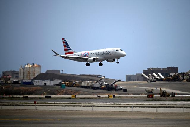 An American Airlines aircraft lands at Simon Bolivar International Airport in La Guaira, La Guaira state, Venezuela, on April 30, 2026. The first direct commercial flight between the United States and Venezuela in seven years arrived in Caracas on April 30, marking a new sign of a thaw after Washington deposed leftist leader Nicolas Maduro and resumed diplomatic relations following years of tension. (Photo by Federico PARRA / AFP)