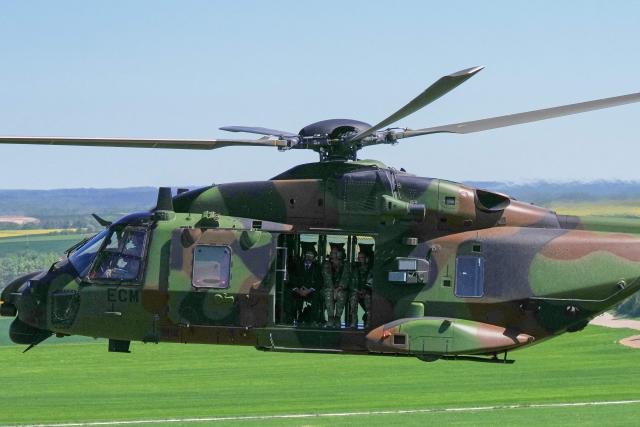 France's President Emmanuel Macron (L) boards a NH90 Caiman helicopter during the Orion 2026 military exercises at a camp in Suippes, eastern France, on April 30, 2026. Troops are being deployed as part of Orion 26, a large-scale exercise launched in February which, in its fourth and final phase, currently involves up to 12,500 military personnel. (Photo by Aurelien Morissard / POOL / AFP)
