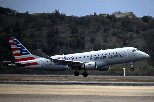An American Eagle aircraft, operating a regional flight for American Airlines, lands at Simon Bolivar International Airport in La Guaira, La Guaira state, Venezuela on April 30, 2026. The first direct commercial flight between the United States and Venezuela in seven years arrived in Caracas on April 30, marking a new sign of a thaw after Washington deposed leftist leader Nicolas Maduro and resumed diplomatic relations following years of tension. (Photo by Federico PARRA / AFP)