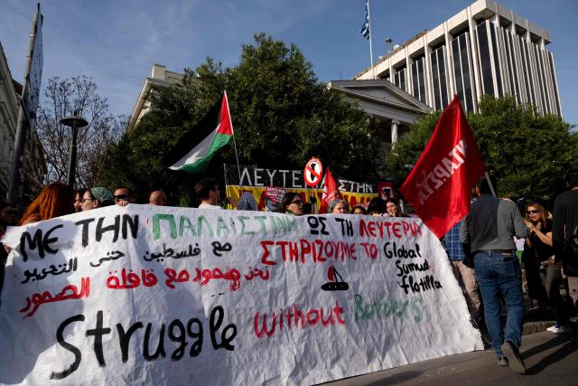Protesters hold banners and chant as they gather outside the Ministry of Foreign Affairs to protest against the detention of members of the Global Sumud Flotilla off the Greek island of Crete by the Israeli navy, in Athens on April 30, 2026. The Israeli navy intercepted and halted part of the Global Sumud Flotilla, a convoy of vessels bound for Gaza as it sailed in international waters west of the island of Crete. According to Israeli sources and flotilla organizers, at least twenty boats were boarded and around 175 activists were detained and transferred to Israel. (Photo by Aggelos NAKKAS / AFP)