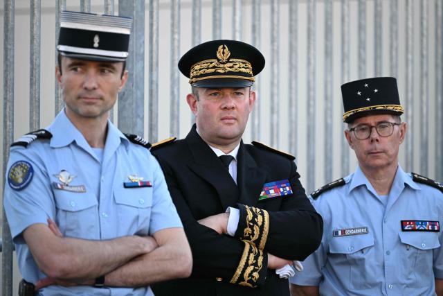 Yvelines Prefect Frédéric Rose (C) attends the visit of France's Interior Minister at the gendarmerie in Ecquevilly, on the outskirts of Paris, on April 30, 2026, which is focused on the urban violences that have affected the Yvelines French Department. (Photo by Martin LELIEVRE / AFP)