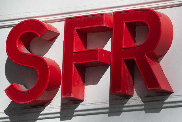 (FILES) A picture taken on March 25, 2021 shows the sign of French mobile communications company SFR of a shop in the centre of Nantes, western France. Three trade unions are calling on SFR shop staff to strike on May 2, 2026, AFP learned on April 30, 2026 from union sources, due to job security concerns at a time when Bouygues Telecom, Free-Iliad Group and Orange are negotiating the takeover of the operator. (Photo by LOIC VENANCE / AFP)