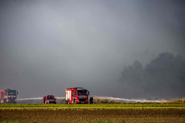 Firefighters operate at Kempen Airport during a wildfire in Weerterheide in Limburg, southeastern Netherlands on April 30, 2026. (Photo by ROB ENGELAAR / ANP / AFP) / Netherlands OUT