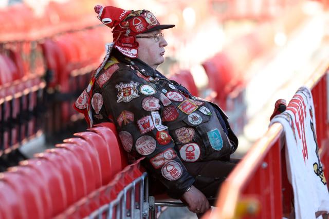 A Forest fan waits in the stand ahead of kick off in the UEFA Europa League semi-final first-leg football match between Nottingham Forest and Aston Villa at The City Ground in Nottingham, central England, on April 30, 2026. (Photo by Darren Staples / AFP)