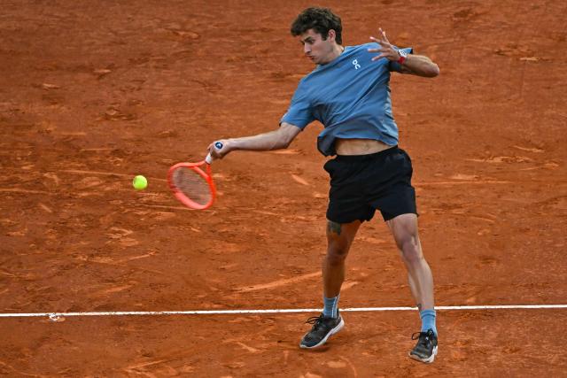 Italy's Flavio Cobolli returns a ball to Germany's Alexander Zverev during their 2026 ATP Tour Madrid Open tennis tournament quarter-final singles match at the Caja Magica in Madrid, on April 30, 2026. (Photo by Javier SORIANO / AFP)
