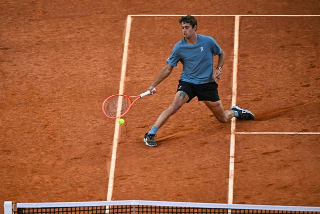 Italy's Flavio Cobolli returns a ball to Germany's Alexander Zverev during their 2026 ATP Tour Madrid Open tennis tournament quarter-final singles match at the Caja Magica in Madrid, on April 30, 2026. (Photo by Javier SORIANO / AFP)