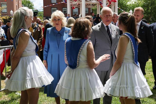 Britain's King Charles III and Queen Camilla greet people during a parade and block party on the final day of the state visit of King Charles III and Queen Camilla on April 30, 2026 in Front Royal, Virginia. (Photo by Win McNamee / POOL / AFP)