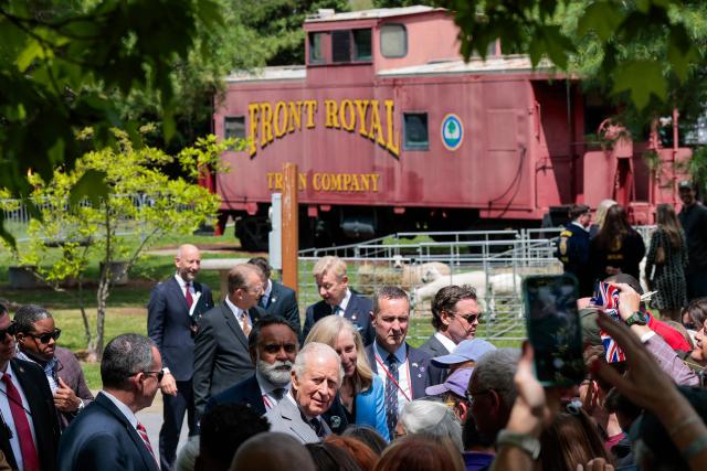 Britain's King Charles and Virginia Gov. Abigail Spanberger walk among community members during a block party on April 30, 2026 in Front Royal, Virginia. (Photo by Kylie Cooper / POOL / AFP)