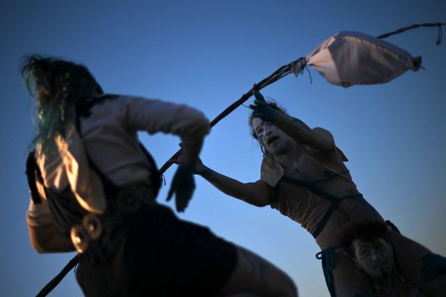 Performers take part in the Beltane Fire Festival on Calton Hill, Edinburgh on April 30, 2026. The annual event is inspired by the pre-Christian spring-time festival and is intended to emphasise a connection with the passing of the seasons. (Photo by ANDY BUCHANAN / AFP)