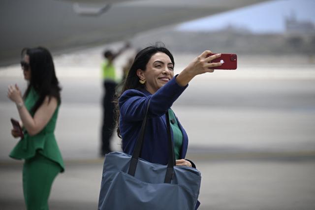 Natalia Molano, spokesperson for the US State Department, poses for a selfie after landing at Simon Bolivar International Airport in La Guaira, La Guaira state, Venezuela on April 30, 2026. The first direct commercial flight between the United States and Venezuela in seven years arrived in Caracas on April 30, marking a new sign of a thaw after Washington deposed leftist leader Nicolas Maduro and resumed diplomatic relations following years of tension. (Photo by Federico PARRA / AFP)