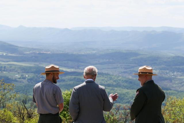 Britain's King Charles III talks with park ranger Karl Rand (L) and Tracy Stakely, Superintendent of Shenandoah National Park, as he visits Shenandoah National Park in Front Royal, Virginia, on April 30, 2026. (Photo by Kevin Lamarque / POOL / AFP)