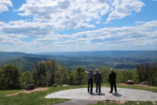 Britain's King Charles III talks with park ranger Karl Rand (L) and Tracy Stakely, Superintendent of Shenandoah National Park, as he visits Shenandoah National Park in Front Royal, Virginia, on April 30, 2026. (Photo by Chip Somodevilla / POOL / AFP)