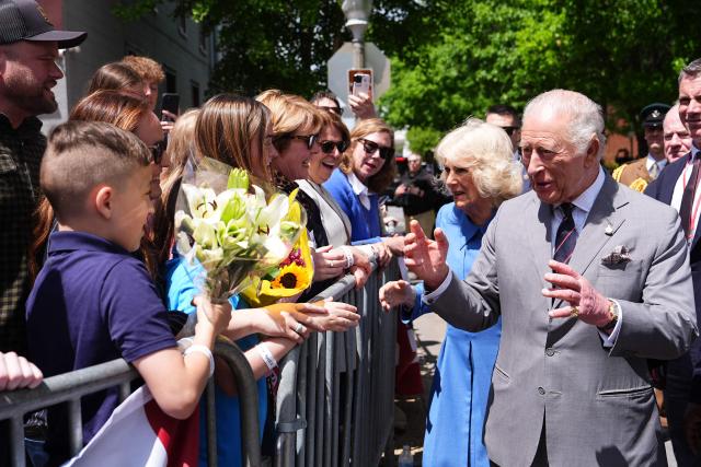 Britain's King Charles III and Queen Camilla greet well wishers during the Front Royal Virginia Parade and Block Party in Front Royal, Virginia, on April 30, 2026. (Photo by Aaron Chown / POOL / AFP)