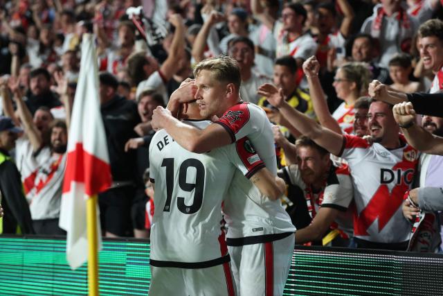 Rayo Vallecano's Brazilian forward #09 Alexandre Zurawski "Alemao" (R) celebrates scoring his team's first goal with teammate Rayo Vallecano's Spanish forward #19 Jorge de Frutos during the UEFA Conference League semi final first leg football match between Rayo Vallecano de Madrid and RC Strasbourg Alsace at Vallecas Stadium in Madrid on April 30, 2026. (Photo by Pierre-Philippe MARCOU / AFP)