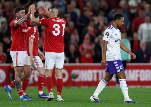 Nottingham Forest's Serbian defender #31 Nikola Milenkovic (2L) celebrates after Aston Villa's Belgian midfielder  #08 Youri Tielemans (R) missed a shot during the UEFA Europa League semi-final first-leg football match between Nottingham Forest and Aston Villa at The City Ground in Nottingham, central England, on April 30, 2026. (Photo by Darren Staples / AFP)