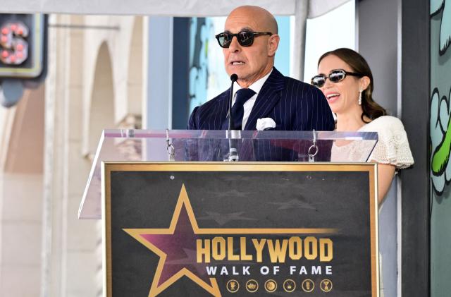 US actor Stanley Tucci speaks next to his sister in law US-British actress Emily Blunt during the unveiling ceremony of their adjoining stars on the Walk of Fame in Hollywood, California on April 30, 2026. (Photo by Frederic J. BROWN / AFP)