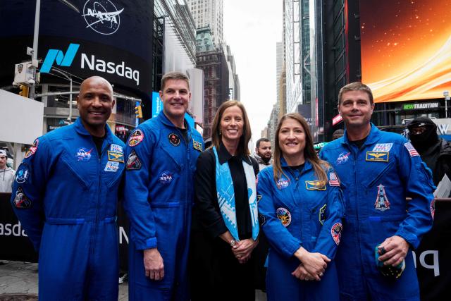 (L/R) Artemis II pilot Victor Glover, Artemis II mission specialist Jeremy Hansen, Adena Friedman, Chair and Chief Executive Officer at Nasdaq, Artemis II mission specialist Christina Koch and Artemis II Commander Reid Wiseman pose outside the Nasdaq Marketsite in Times Square in New York City on April 30, 2026.


A photo of the moon is seen on a screen as The New York Stock Exchange welcomed NASA to the podium in celebration of the historic Artemis II mission in New York on April 30, 2026. (Photo by Adam GRAY / AFP)