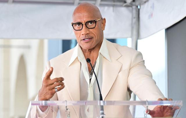 US-Canadian actor Dwayne Johnson speaks during the unveiling ceremony of US-British actress Emily Blunt and US actor Stanley Tucci's adjoining stars at the Walk of Fame in Hollywood, California on April 30, 2026. (Photo by Frederic J. BROWN / AFP)