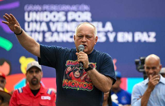 Venezuela's Interior Minister Diosdado Cabello speaks during a march calling for the lifting of all US sanctions in Caracas on April 30, 2026. Venezuela's acting president Delcy Rodriguez announced on April 30 a 26% wage increase to the so-called "integral minimum income," raising it from 190 dollars to 240 dollars per month, the first adjustment since Nicolas Maduro's fall. (Photo by Juan BARRETO / AFP)