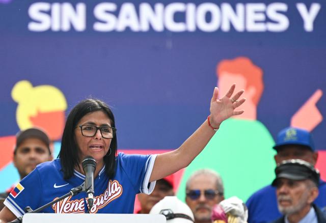Venezuela's acting president Delcy Rodriguez speaks during a march calling for the lifting of all US sanctions in Caracas on April 30, 2026. Delcy Rodriguez announced on April 30 a 26% wage increase to the so-called "integral minimum income," raising it from 190 dollars to 240 dollars per month, the first adjustment since Nicolas Maduro's fall. (Photo by Juan BARRETO / AFP)