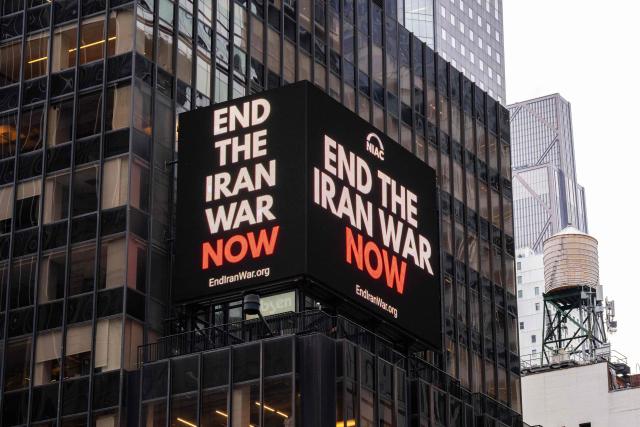 A digital billboard displays an image reading "end the Iran war now" in Times Square in New York City on April 30, 2026. President Donald Trump was facing a midnight deadline on April 30 to secure congressional authorization for the war against Iran, though the looming cutoff is not expected to rein in his military plans. (Photo by Adam GRAY / AFP)