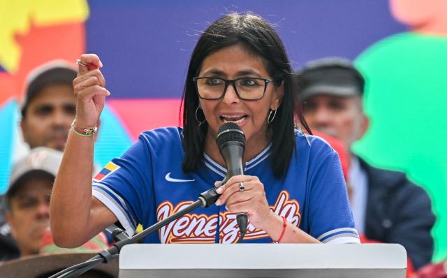 Venezuela's acting president Delcy Rodriguez speaks during a march calling for the lifting of all US sanctions in Caracas on April 30, 2026. Delcy Rodriguez announced on April 30 a 26% wage increase to the so-called "integral minimum income," raising it from 190 dollars to 240 dollars per month, the first adjustment since Nicolas Maduro's fall. (Photo by Juan BARRETO / AFP)