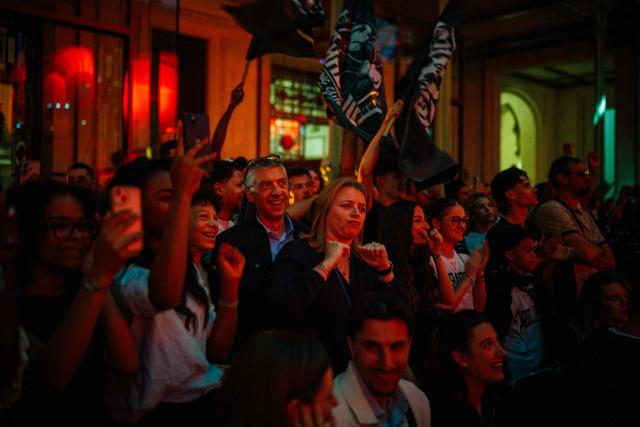 Spectators reacts as they watch an ISKA World Kickboxing Championship event at the Grand Palais in Paris on April 30, 2026. (Photo by Dimitar DILKOFF / AFP)