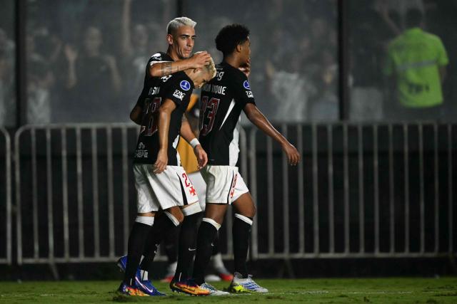 Vasco da Gama's Uruguayan defender #02 Jose Luis Rodriguez (C) celebrates with teammates midfielder #28 Adson (L) and midfielder #83 Ramon Rique after scoring during the Copa Sudamericana group stage football match between Brazil's Vasco da Gama and Paraguay's Olimpia at the Sao Januario stadium in Rio de Janeiro, Brazil on April 30, 2026. (Photo by MAURO PIMENTEL / AFP)