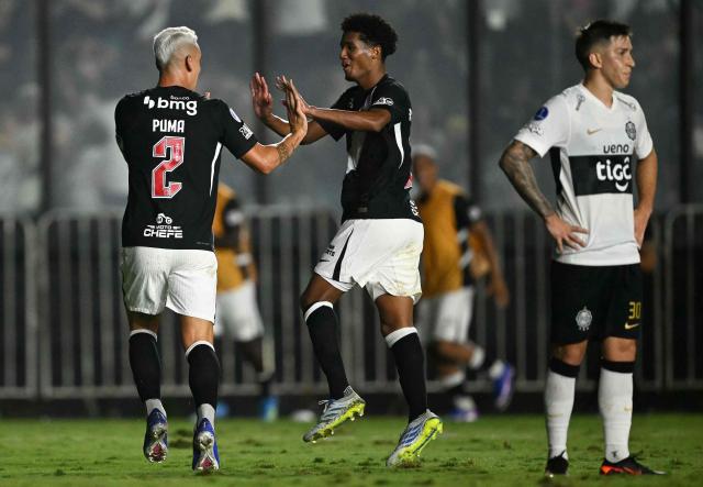 Vasco da Gama's Uruguayan defender #02 Jose Luis Rodriguez celebrates with teammate midfielder #83 Ramon Rique after scoring during the Copa Sudamericana group stage football match between Brazil's Vasco da Gama and Paraguay's Olimpia at the Sao Januario stadium in Rio de Janeiro, Brazil on April 30, 2026. (Photo by MAURO PIMENTEL / AFP)