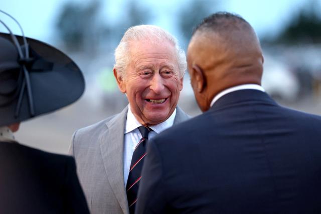 Britain's King Charles III is greeted upon arrival to the L.F. Wade International Airport in Hamilton, Bermuda, on April 30, 2026. King Charles III is in Bermuda for his first visit to a British Overseas Territory as Sovereign. (Photo by Chris Jackson / POOL / AFP)