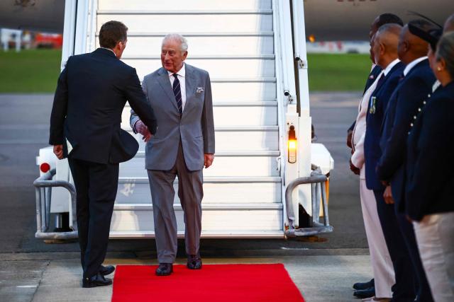 Britain's King Charles III is welcomed upon his arrival to the L.F. Wade International Airport in Hamilton, Bermuda, on April 30, 2026. King Charles III is in Bermuda for his first visit to a British Overseas Territory as Sovereign. (Photo by Henry NICHOLLS / AFP)